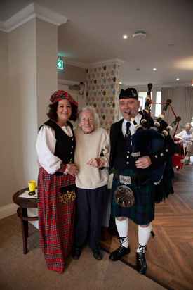 Michele Blake (Wellbeing Manager) June DeMarco (resident) and local musician Alan Cowie.